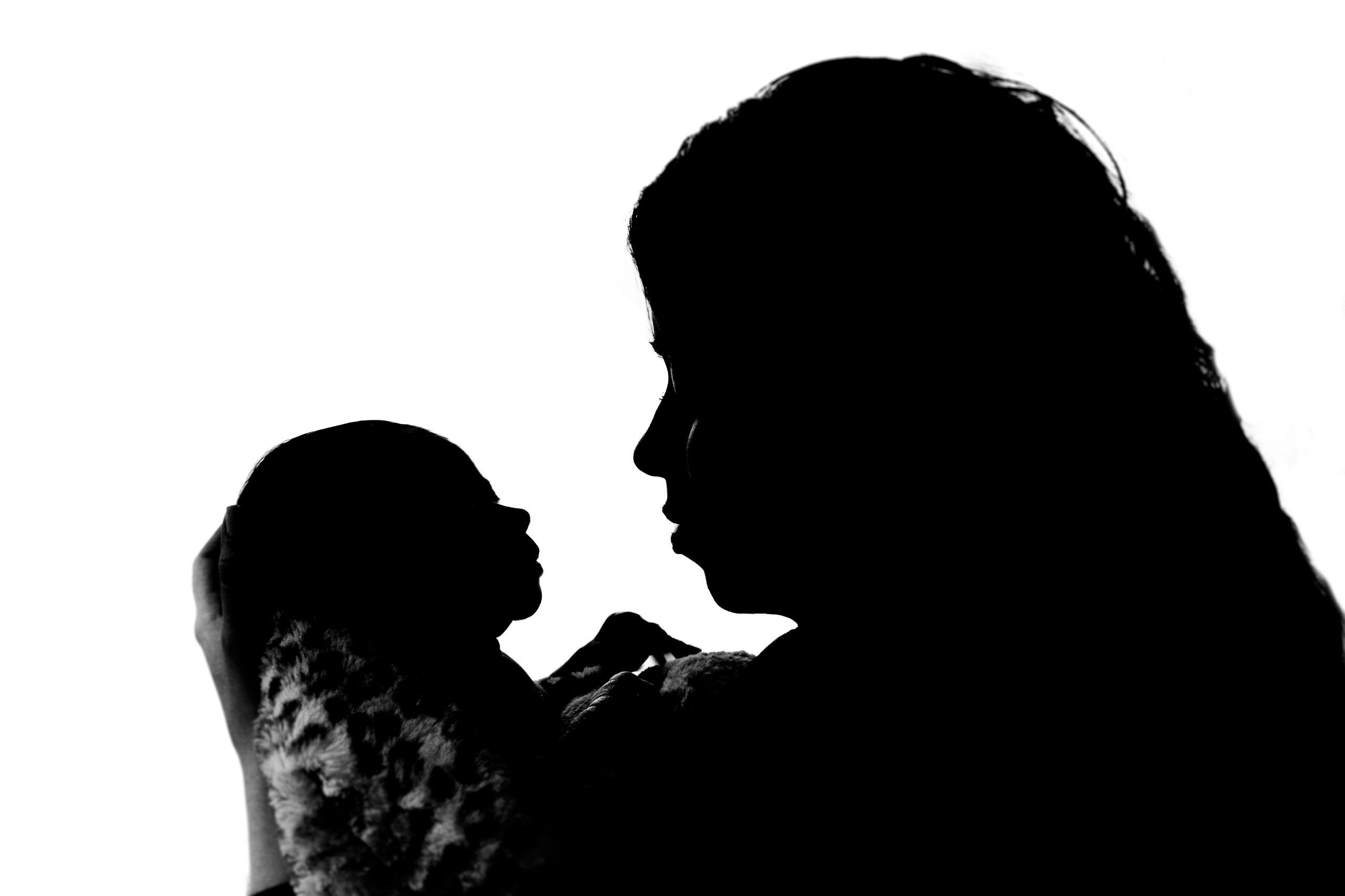 Sillouette of baby and mother